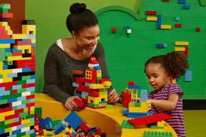 Mom and daughter playing with LEGO bricks